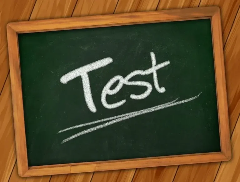 Chalkboard with the word “Test” written in white chalk, representing exams, assessments, or learning evaluation.